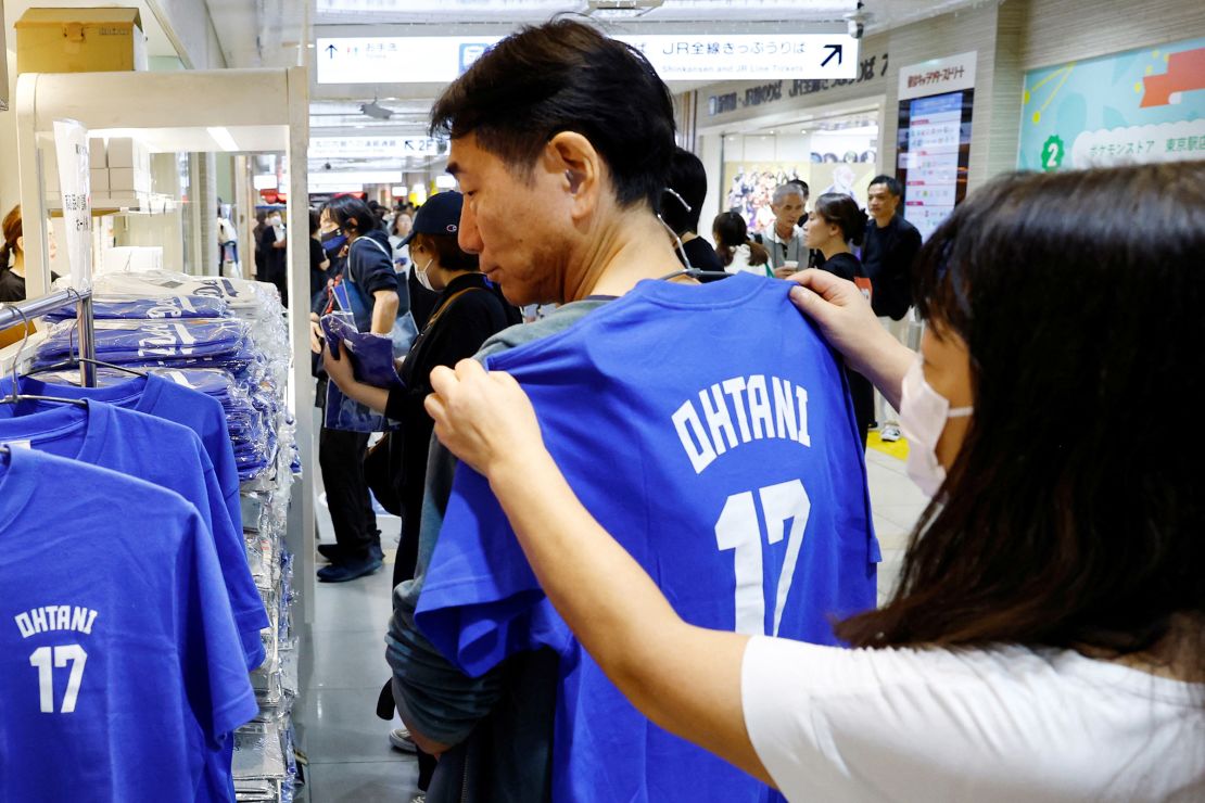 Customers choose a T-shirt at a pop-up store for Major League Baseball star Shohei Ohtani ahead of the first World Series game between the Los Angeles Dodgers and the New York Yankees, in Tokyo, Japan, on October 25, 2024.